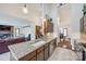 Open kitchen with granite island and views to the living and dining areas at 78 Honeysuckle Woods, Lake Wylie, SC 29710