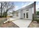 Backyard deck with patio area, gray siding and lush landscaping at 8624 Woodcock Ln, Charlotte, NC 28216