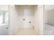 Walk-in closet with white wire shelving, neutral walls and vinyl floor at 8624 Woodcock Ln, Charlotte, NC 28216