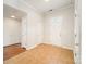 Welcoming foyer features neutral tile flooring, coat closet and lots of space for a homey entry at 8624 Woodcock Ln, Charlotte, NC 28216