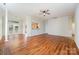 Open concept living room with laminate flooring, architectural columns, and easy access to the kitchen at 8624 Woodcock Ln, Charlotte, NC 28216