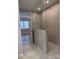 Large walk-in shower with gray tile and glass enclosure at 9625 Liberty Hill Dr, Mint Hill, NC 28227