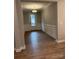 Bright foyer with wood-look floors and white wainscoting at 9625 Liberty Hill Dr, Mint Hill, NC 28227