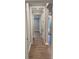 Hallway with wood-look floors and doors to other rooms at 9625 Liberty Hill Dr, Mint Hill, NC 28227