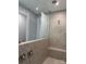 Spa-like shower with glass enclosure, built-in seat, and dual shower heads at 9625 Liberty Hill Dr, Mint Hill, NC 28227