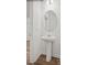 Clean bathroom with pedestal sink and oval mirror at 10006 Travis Floyd Ln # 002, Charlotte, NC 28214