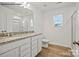Main bathroom with double vanity and shower at 10006 Travis Floyd Ln # 002, Charlotte, NC 28214