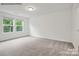 Spacious bedroom with large windows and carpet at 10006 Travis Floyd Ln # 002, Charlotte, NC 28214