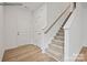 Light and airy entryway with hardwood floors and staircase at 10006 Travis Floyd Ln # 002, Charlotte, NC 28214