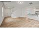 Open living room with hardwood floors and kitchen views at 10006 Travis Floyd Ln # 002, Charlotte, NC 28214