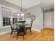 Bright dining area with hardwood floors and charming window at 10607 Newberry Park Ln, Charlotte, NC 28277