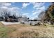 Large backyard with a fenced pool area and mature trees at 107 E Boyd St, Maiden, NC 28650