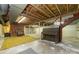 Spacious basement featuring a vintage piano and brick fireplace at 107 E Boyd St, Maiden, NC 28650