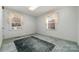Bright bedroom with two windows and carpet at 107 E Boyd St, Maiden, NC 28650
