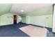 Upstairs bedroom with carpet and window at 107 E Boyd St, Maiden, NC 28650
