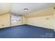 Large bedroom with window and carpet at 107 E Boyd St, Maiden, NC 28650