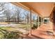 Front porch with tiled floor and porch swing at 107 E Boyd St, Maiden, NC 28650