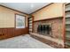 Gathering room with brick fireplace and built-in wooden shelving at 107 E Boyd St, Maiden, NC 28650