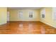 Spacious living room with hardwood floors and large windows at 107 E Boyd St, Maiden, NC 28650