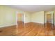 Hardwood floor living room with views to other rooms at 107 E Boyd St, Maiden, NC 28650