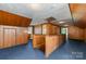 Upper hallway with wood paneling and stairs at 107 E Boyd St, Maiden, NC 28650