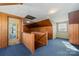 Upper hallway with wood paneling and stairs at 107 E Boyd St, Maiden, NC 28650