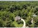 Aerial view of a secluded home surrounded by lush greenery highlighting its privacy and landscaping at 254 Streamside Pl, Mooresville, NC 28115