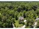 Aerial view of a home in a lush, wooded area, showcasing its privacy and landscaping at 254 Streamside Pl, Mooresville, NC 28115