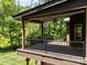 Expansive deck area with a ceiling fan and view of the lush backyard, perfect for outdoor living at 254 Streamside Pl, Mooresville, NC 28115