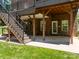View of backyard featuring stairs leading to upper deck and a covered patio at 254 Streamside Pl, Mooresville, NC 28115