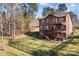 Spacious backyard with deck, hot tub, and fenced area at 254 Streamside Pl, Mooresville, NC 28115