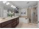 Elegant bathroom with double vanity, soaking tub, and shower at 254 Streamside Pl, Mooresville, NC 28115