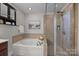 Bathroom with soaking tub and walk-in shower at 254 Streamside Pl, Mooresville, NC 28115