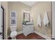 Basement bathroom with single vanity at 254 Streamside Pl, Mooresville, NC 28115