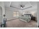 Spacious primary bedroom with carpeted floors and large window at 254 Streamside Pl, Mooresville, NC 28115