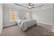 Bright bedroom with carpeted floors and ceiling fan at 254 Streamside Pl, Mooresville, NC 28115