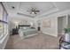 Main bedroom with carpeted floors and tray ceiling at 254 Streamside Pl, Mooresville, NC 28115