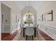 Formal dining room featuring a chandelier and large arched window at 254 Streamside Pl, Mooresville, NC 28115