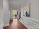 Spacious foyer with hardwood floors, access to backyard, and elegant wall art at 254 Streamside Pl, Mooresville, NC 28115