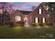 Brick house with landscaped lawn and walkway at 254 Streamside Pl, Mooresville, NC 28115