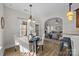 Eat-in kitchen with breakfast nook and views into the living room at 254 Streamside Pl, Mooresville, NC 28115