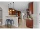 Updated kitchen with dark wood cabinets and breakfast bar at 254 Streamside Pl, Mooresville, NC 28115