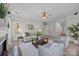 Bright living room with fireplace, hardwood floors, and ample natural light at 254 Streamside Pl, Mooresville, NC 28115