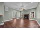 Spacious living room featuring hardwood floors and a wood-burning stove at 254 Streamside Pl, Mooresville, NC 28115