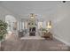 Cozy living room with fireplace, large windows, and comfortable seating at 254 Streamside Pl, Mooresville, NC 28115