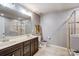 Bathroom with double vanity, large mirror, and walk in shower at 3033 Honeylocust Ln, Fort Mill, SC 29707