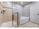 Bathroom with soaking tub and glass-enclosed shower at 3033 Honeylocust Ln, Fort Mill, SC 29707
