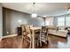Bright dining area with table and chairs, adjacent to kitchen and living room at 3033 Honeylocust Ln, Fort Mill, SC 29707