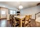 Open dining area with wooden table and chairs, near entryway and stairs at 3033 Honeylocust Ln, Fort Mill, SC 29707