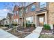 Brick townhouse with landscaped front yard and walkway at 3033 Honeylocust Ln, Fort Mill, SC 29707